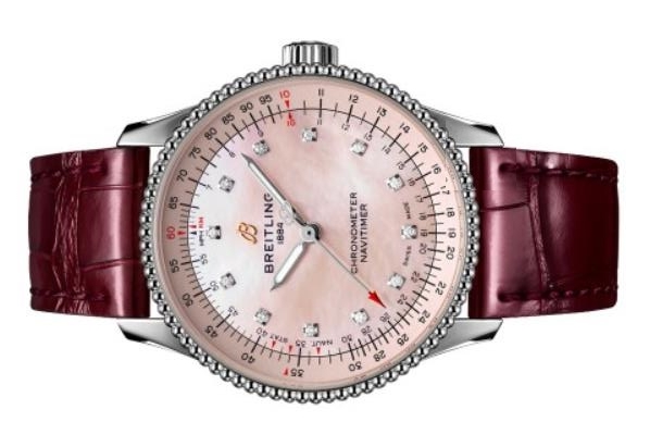 The wine red strap copy watch has diamond hour marks.